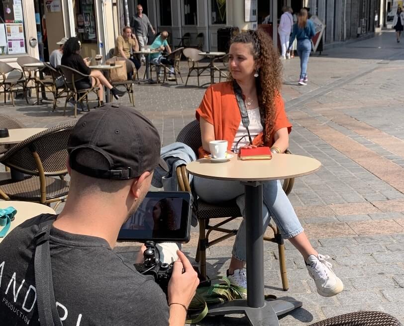 Image of a woman sitting in a public place